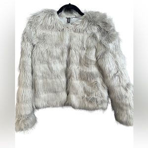 This is a gray faux fur coat, it’s very fancy and will up any outfit!